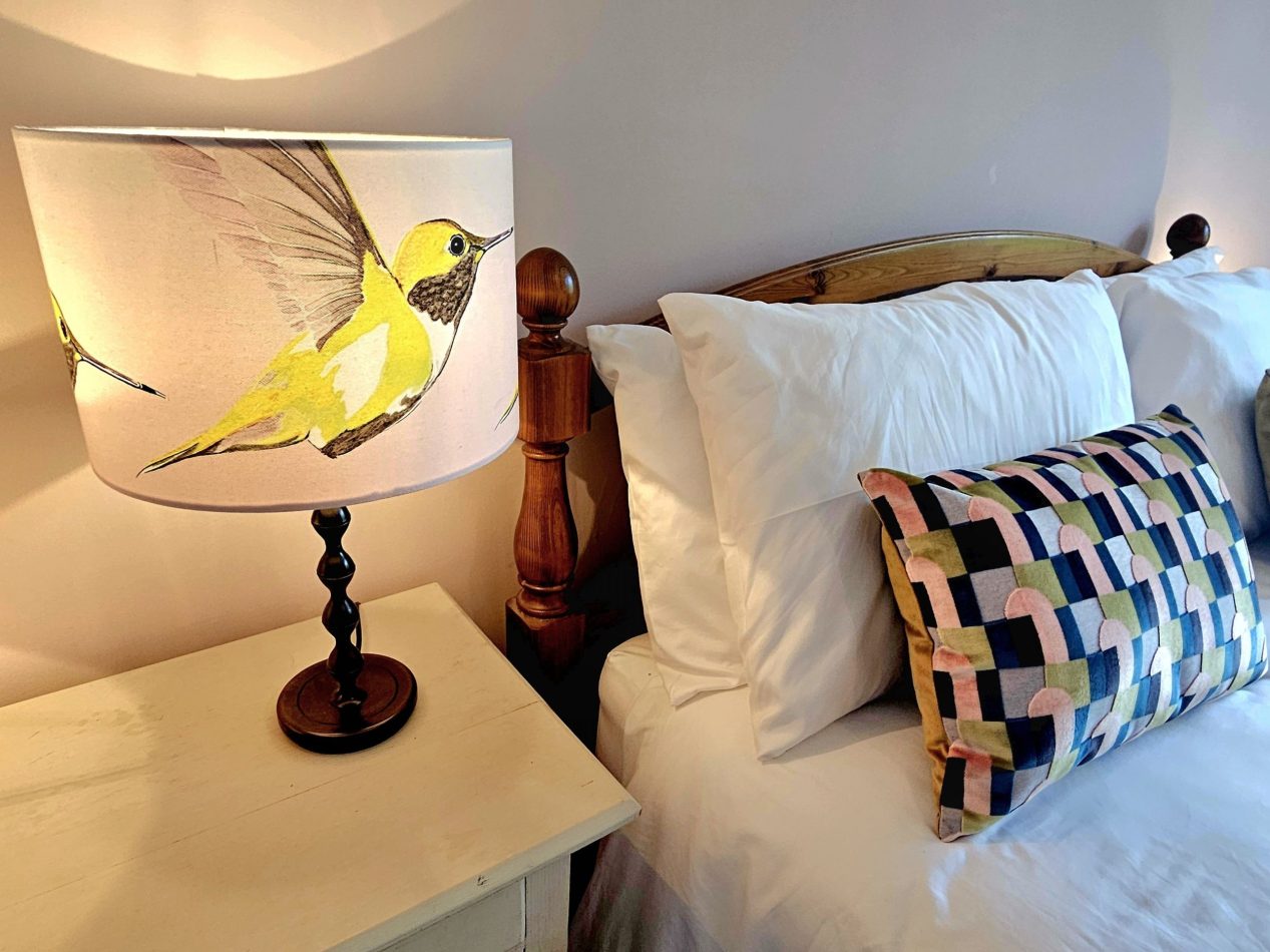 Soft greens and dusky pink tones come together in the details, creating a warm, calming palette that invites you to unwind and feel completely at ease.