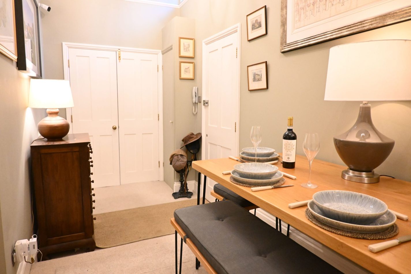 Your hallway doubles as a bright dining area, offering a relaxed space to gather for meals, plan your day or enjoy a glass of wine in your central Sandwich apartment, just moments from cafés and pubs.