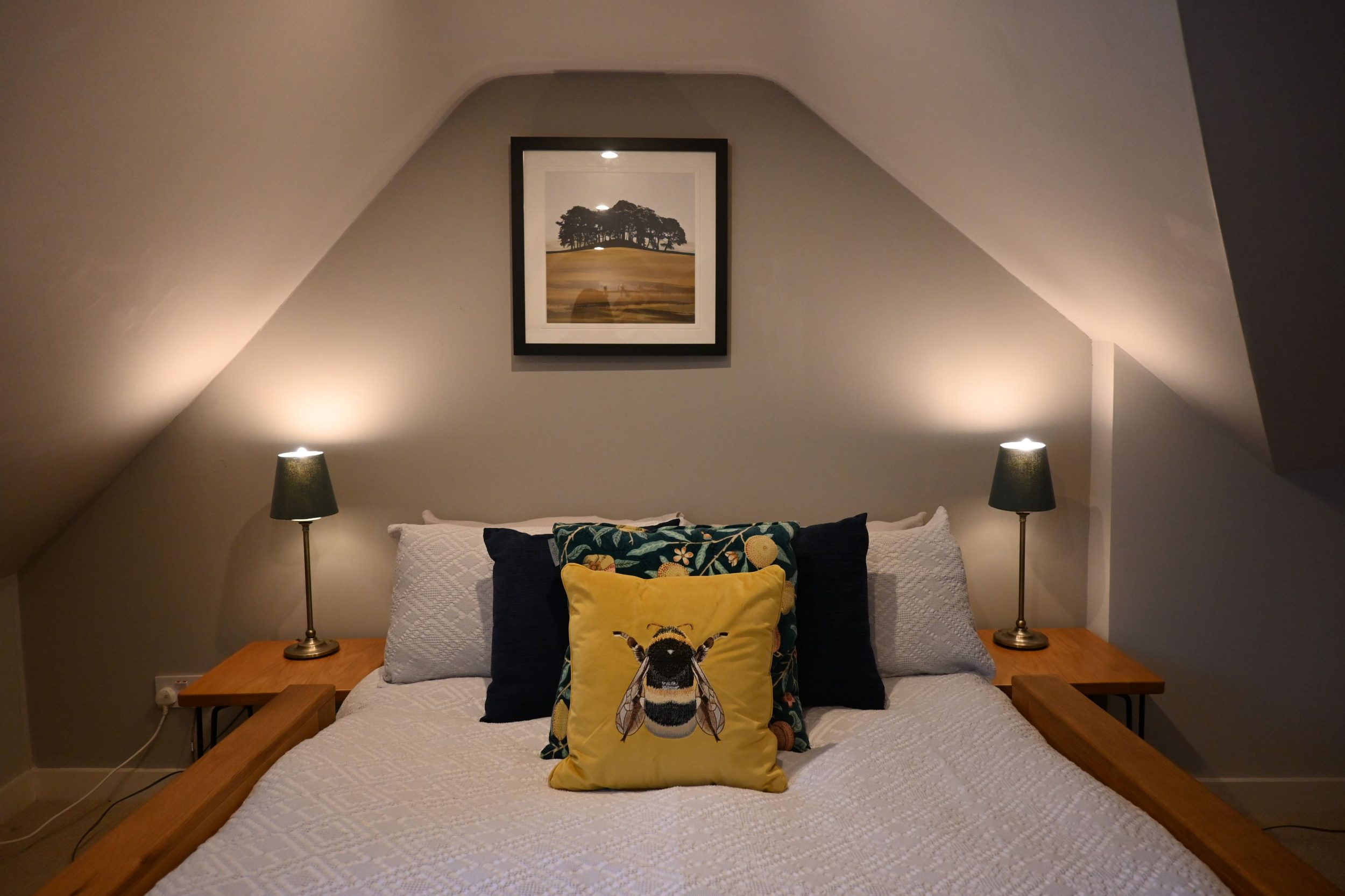 Your upstairs bedroom is tucked into the eaves, offering a cosy, characterful retreatâ€”perfect for peaceful nights in your central Sandwich apartment after days by the coast or on the golf course.