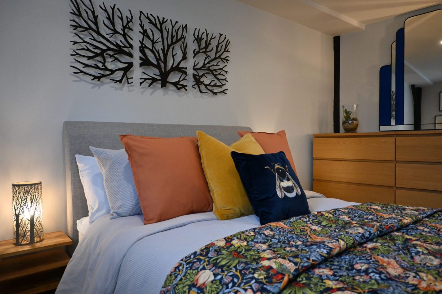 Your main bedroom is a calm and inviting retreat, thoughtfully styled for comfort with soft tones and garden views—perfect for restful nights in your central Sandwich apartment, close to the coast and golf.