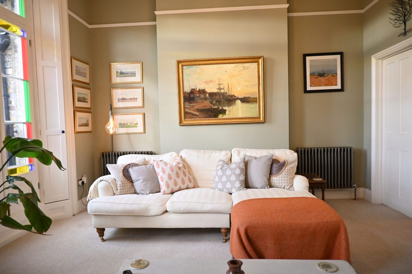 Your generous living area is anchored by an impressive, sink-in sofa—perfect for stretching out after a day by the coast or on the golf course, with plenty of space to relax, unwind and feel completely at home.