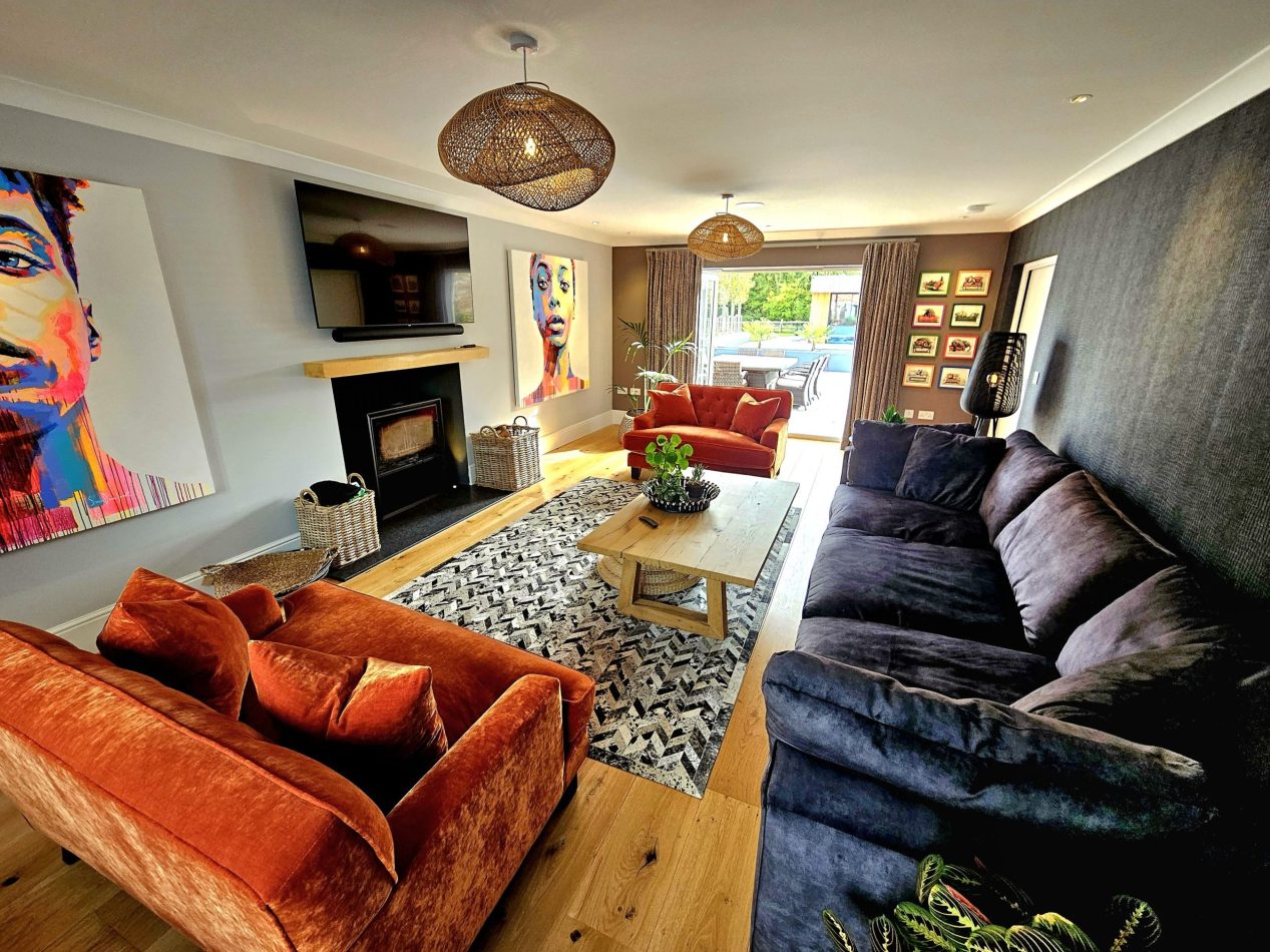 Relax in the colourful main lounge with a cosy log burner and patio doors opening onto the garden. A bright, inviting space perfect for indoor-outdoor living, relaxed evenings and year-round stays in this Kent holiday home.