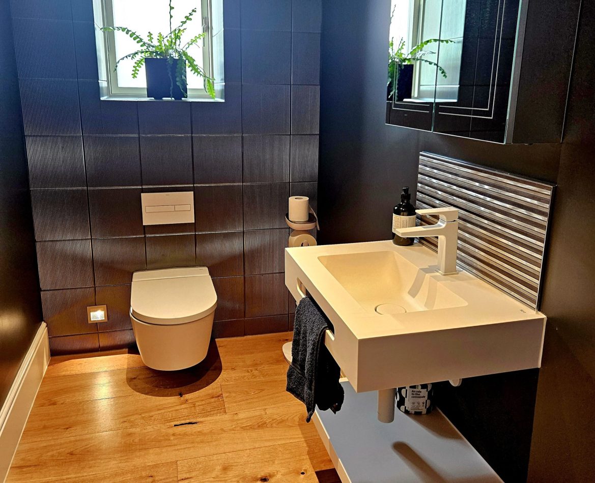 A convenient downstairs cloakroom adds practicality to your stay, ideal for guests and busy mornings. A thoughtful touch that enhances comfort and ease in this luxury Kent holiday home.