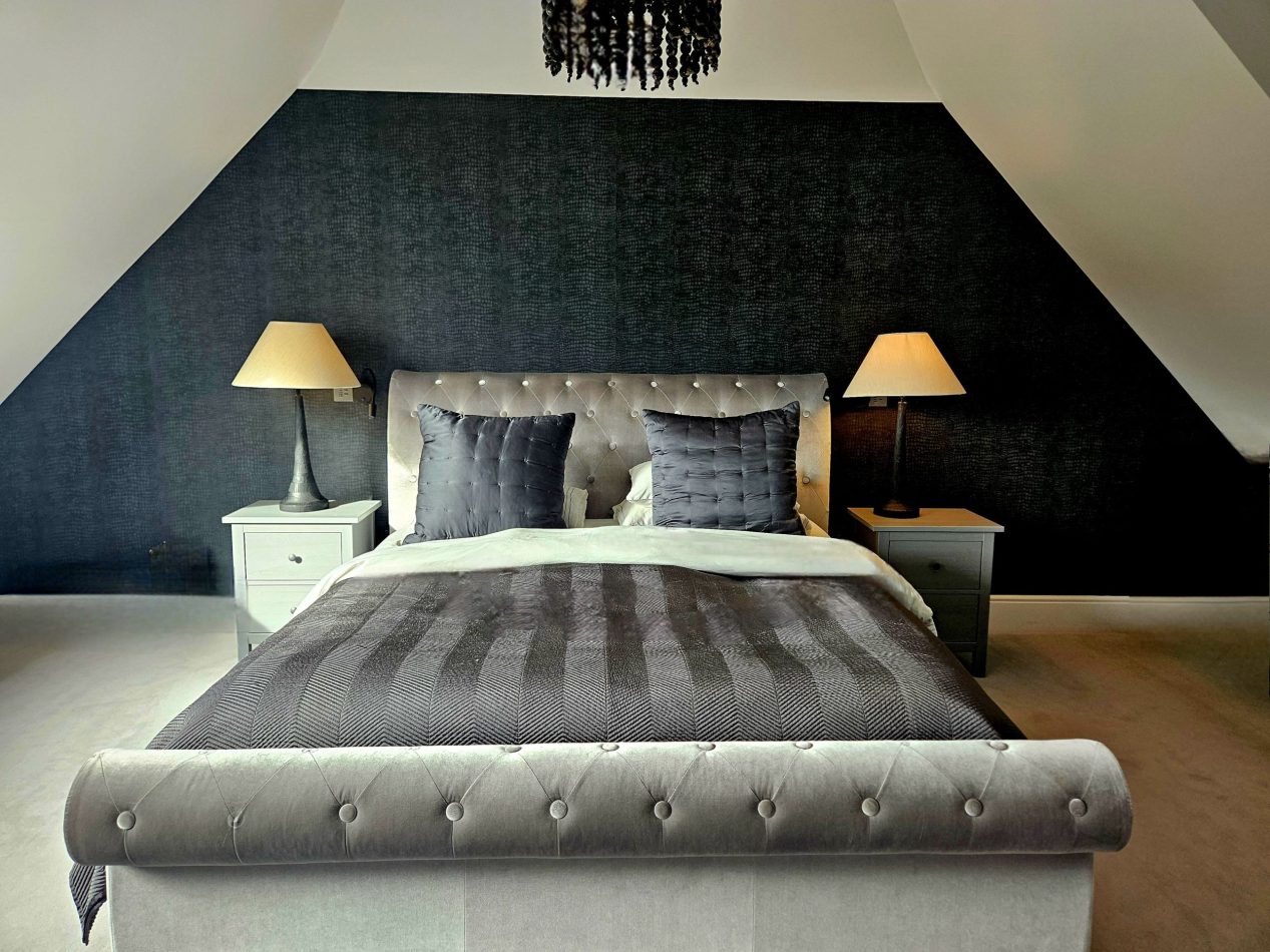 Unwind in the spacious master suite, styled in cool black, white and grey tones for a sleek, modern feel. With a private ensuite and plenty of room to relax, it’s a luxurious retreat within this Kent holiday home.