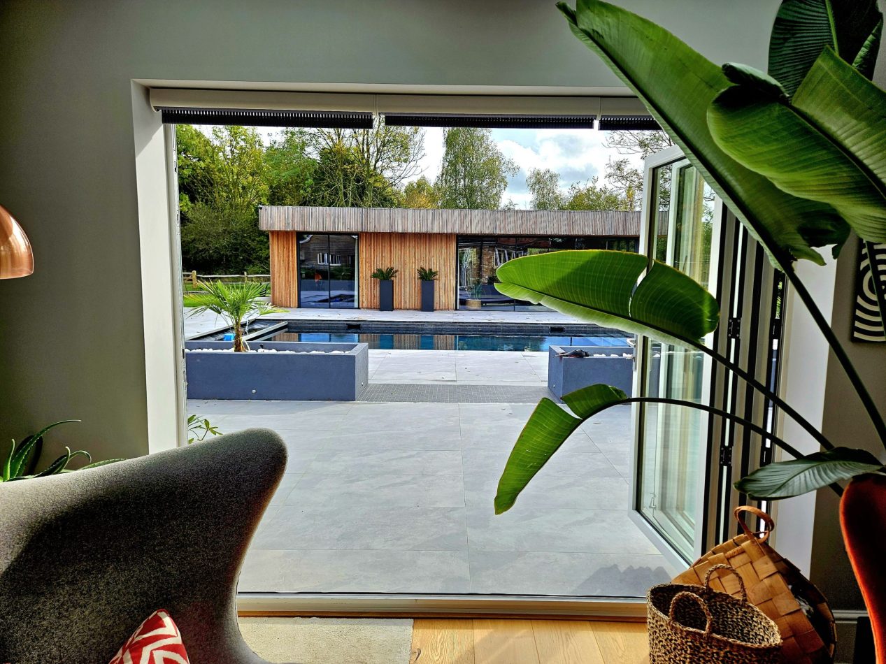 Enjoy a kitchen view overlooking the outdoor heated pool, bringing light and connection to the garden. Perfect for sociable cooking, morning coffee and seamless indoor-outdoor living in this luxury Kent holiday home.
