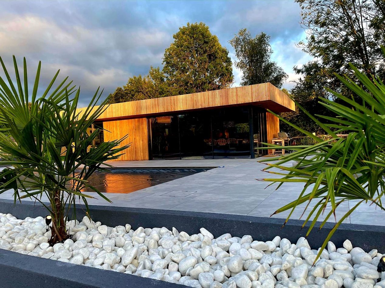 Take in the pool house from the water’s edge, with the outdoor heated pool creating a seamless, luxurious setting. Perfect for relaxed swims, alfresco living and unforgettable stays in this Kent holiday home.