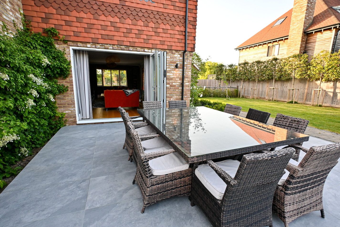 Dine al fresco with outdoor dining furniture, perfect for long lunches and warm summer evenings. A welcoming space to gather, eat and enjoy relaxed countryside living in this luxury Kent holiday home.