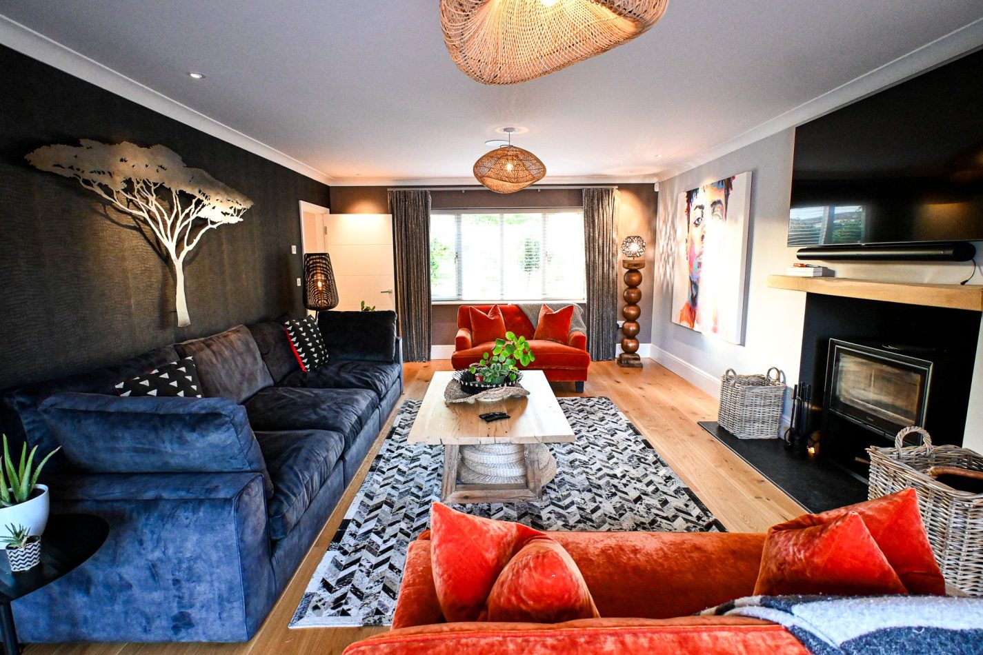 Relax in the large colourful living room with a cosy log burner, creating a warm and inviting space. Perfect for sociable evenings, family time and year-round stays in this luxury Kent holiday home.