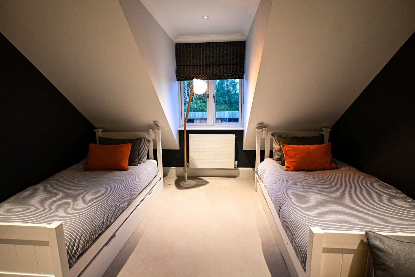 A fun and flexible bedroom with two single beds plus two trundle beds, ideal for children or extra guests. Perfect for family stays, sleepovers and relaxed group getaways in this Kent holiday home.