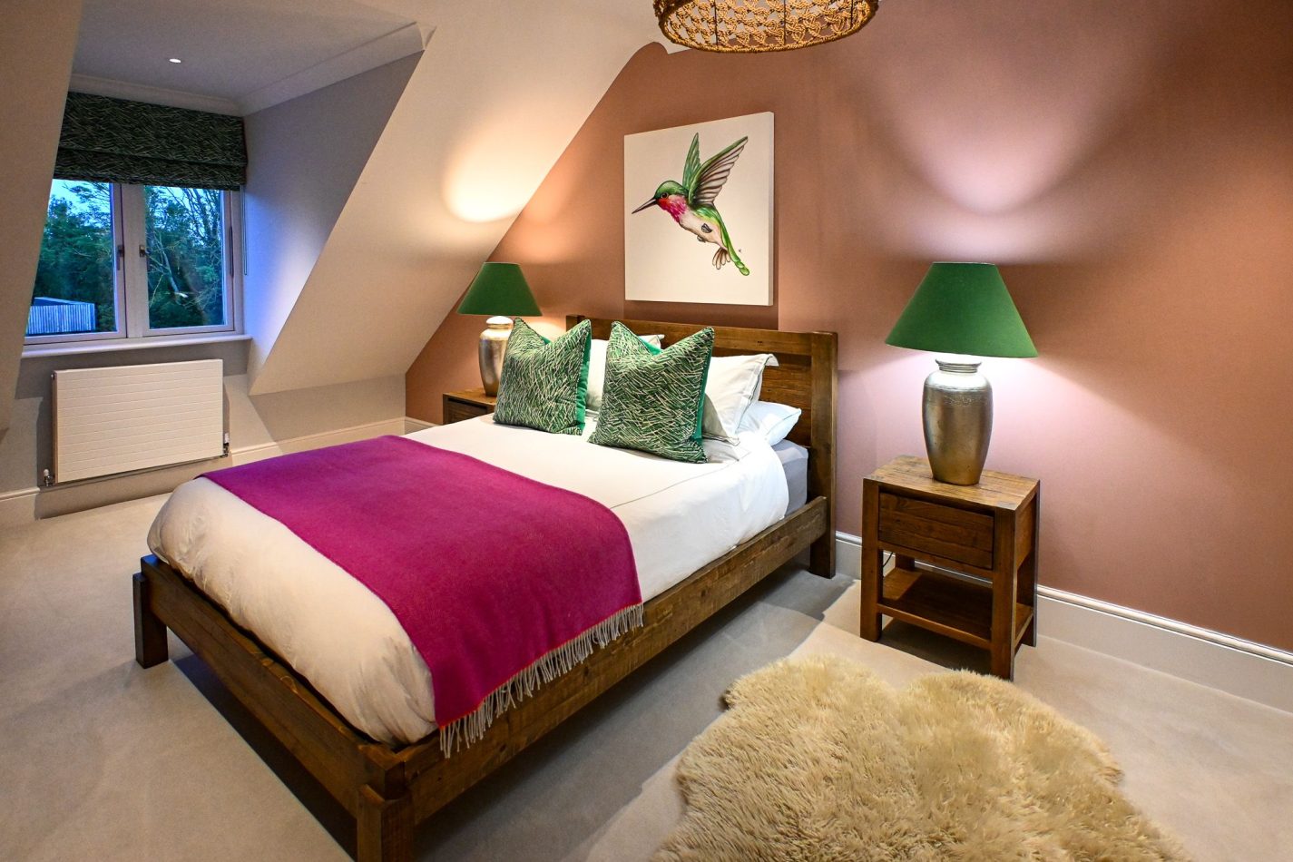 Wake to peaceful pool views from this spacious bedroom, complete with a private ensuite for added comfort. A calm, stylish retreat perfect for relaxing stays in this luxury Kent holiday home.
