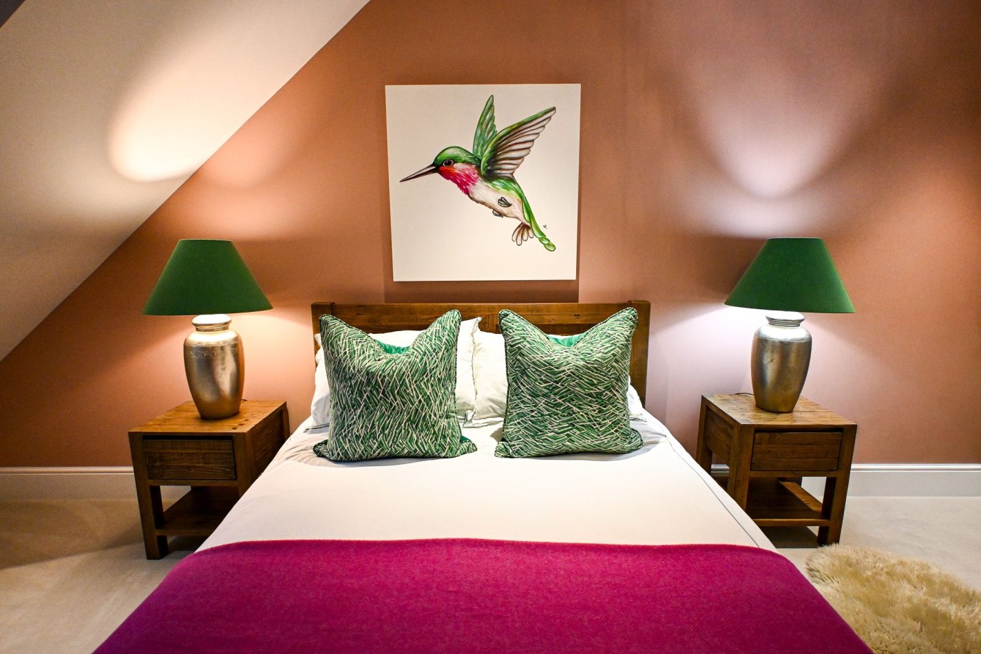 Wake to pool views from this spacious double bedroom, styled in soft pinks and greens for a calm, elegant feel. Complete with a private ensuite, it’s a peaceful retreat in this luxury Kent holiday home.