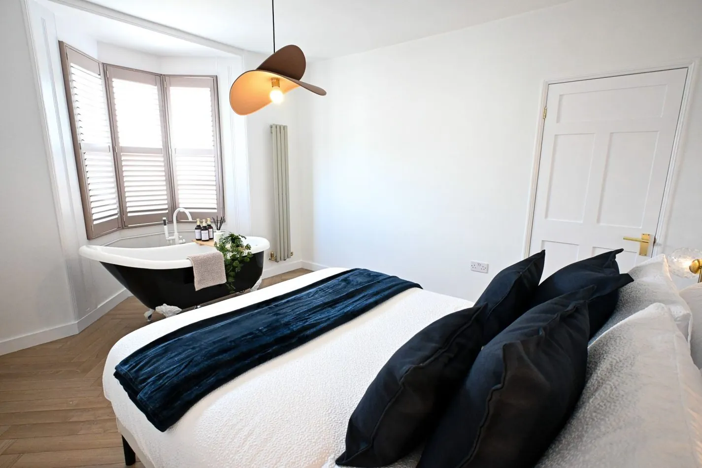Wake up in one of Kent House's most memorable bedrooms, where a luxurious roll-top bath sits elegantly beside the bay window. Combining boutique hotel style with coastal charm, it's the perfect space to relax, recharge and indulge during your Ramsgate esc
