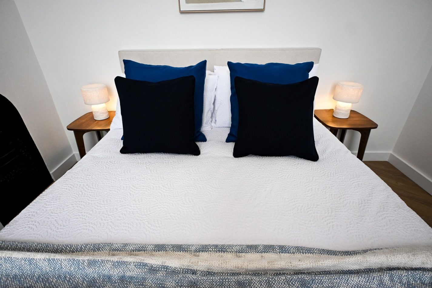 Drift off in comfort in this beautifully appointed king bedroom, where crisp white linens and rich coastal blues create a calm and restful atmosphere. The perfect sanctuary to return to after days spent exploring Ramsgate's harbour, beach and charming old