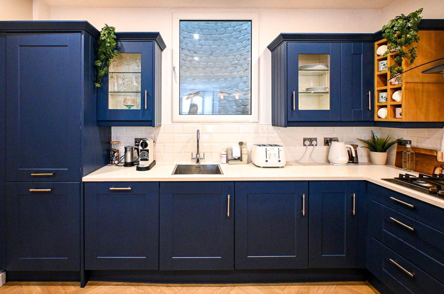 Whether you're preparing a family feast or a leisurely holiday breakfast, this beautifully designed navy kitchen offers everything you need. Combining stylish finishes with practical space, it's the perfect hub for gathering, cooking and making memories t