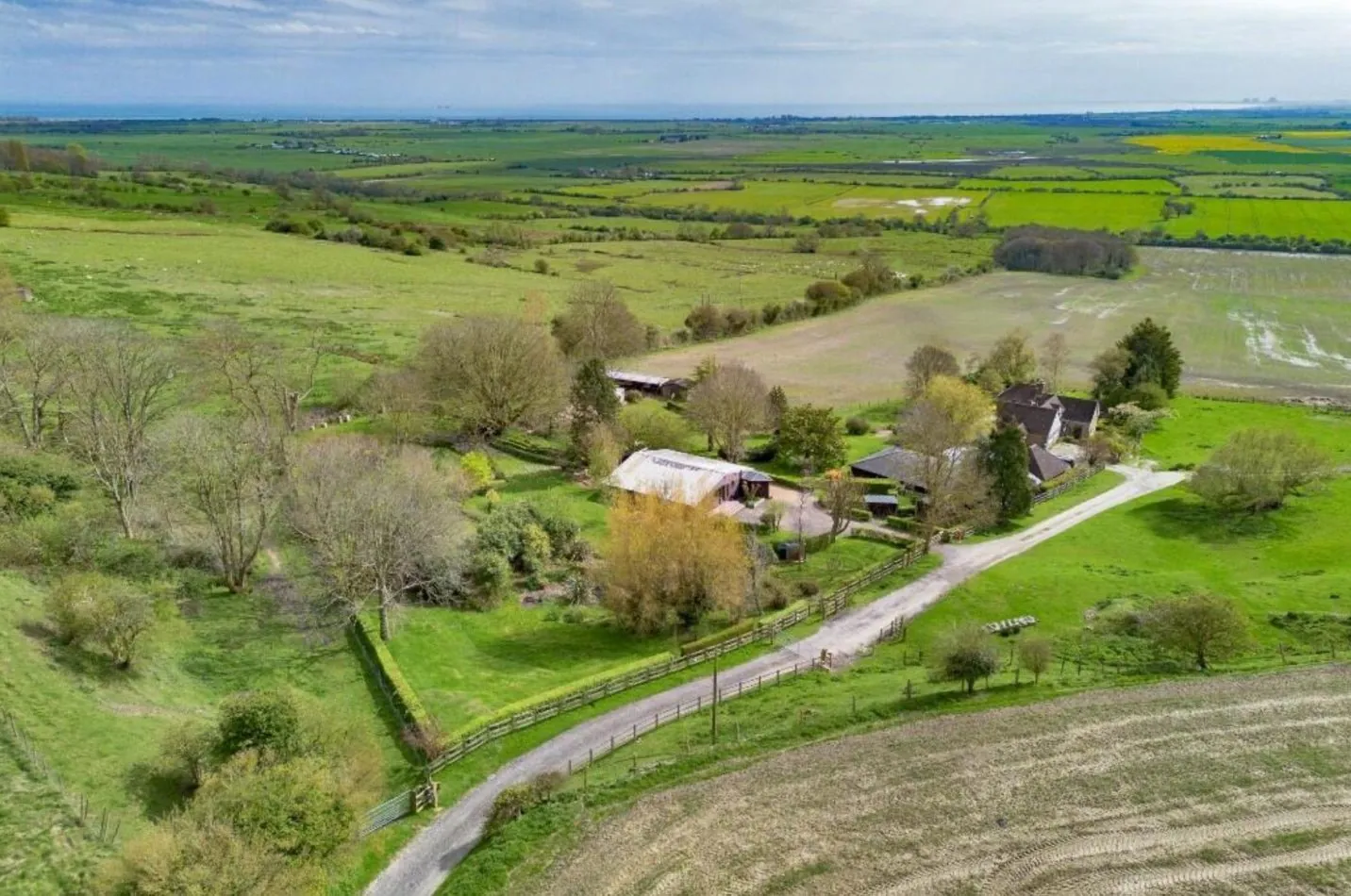 From above, Piglet’s Place is revealed as a secluded rural retreat, tucked among trees and fields with the Kent coast on the horizon.