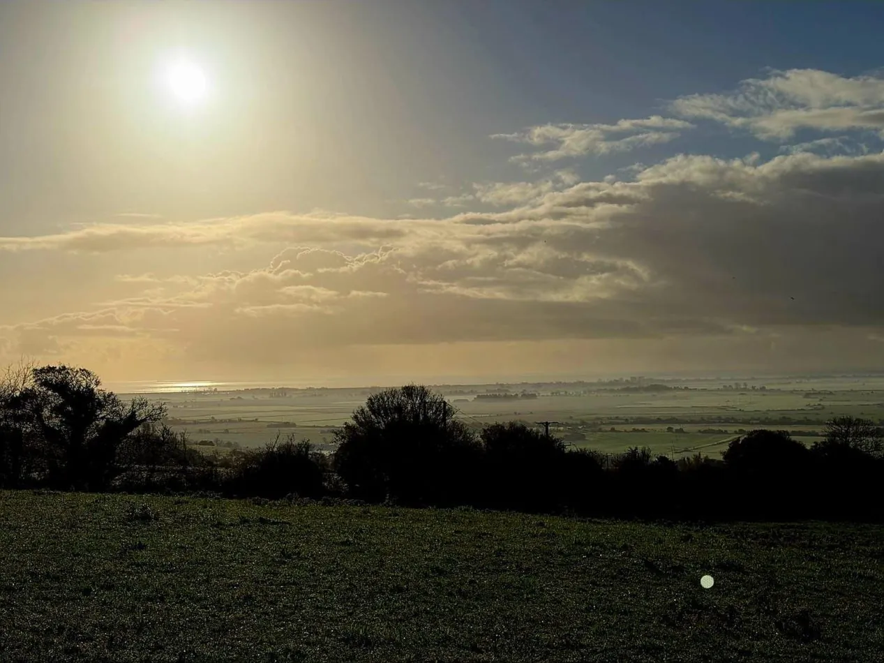 Watch sunlight spill through the clouds and across Romney Marsh, creating a breathtaking view that feels different every time you look.