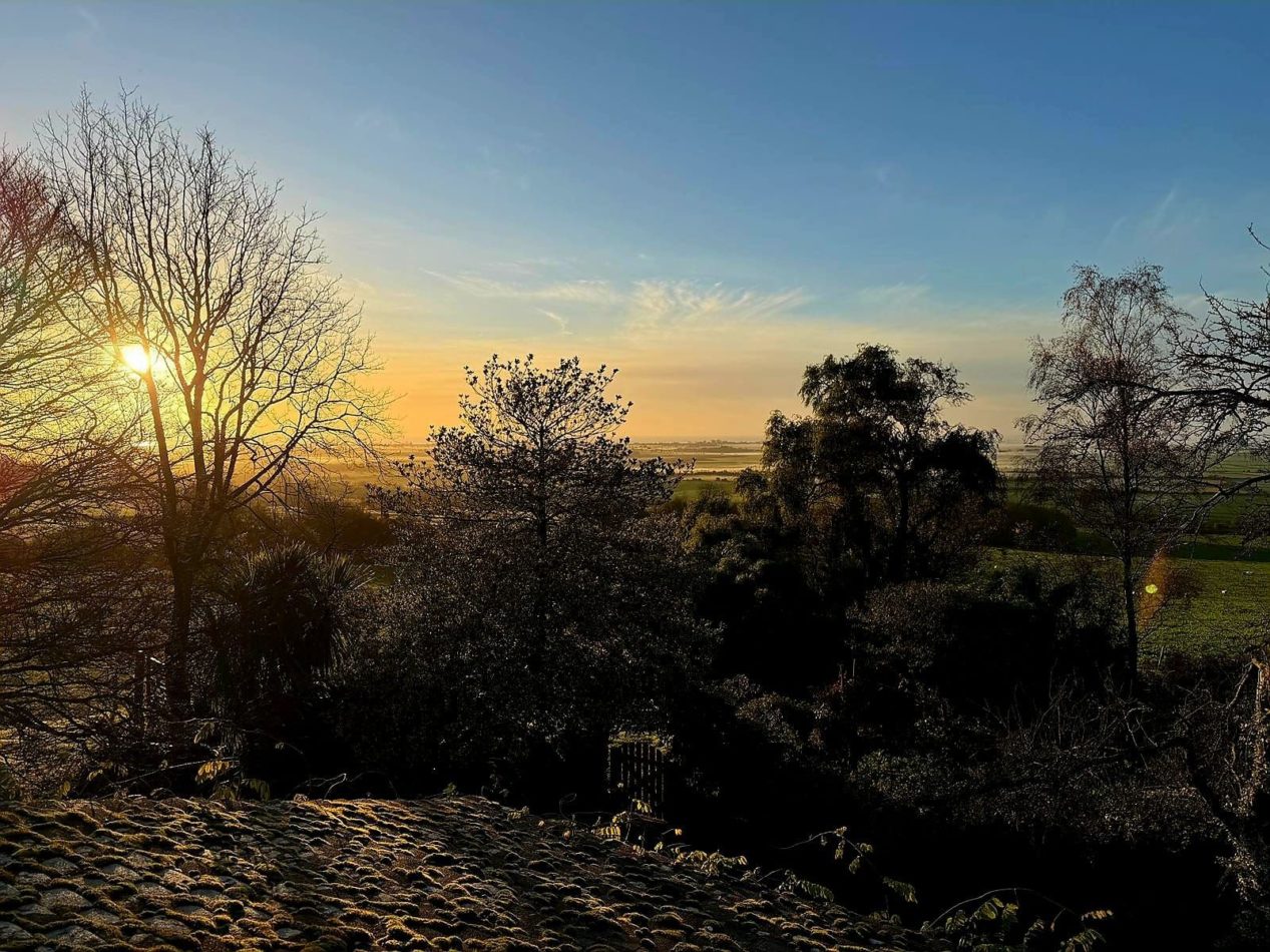 Watch the sun set beyond the trees, filling the sky with warm colour and ending another peaceful day at Piglet’s Place.