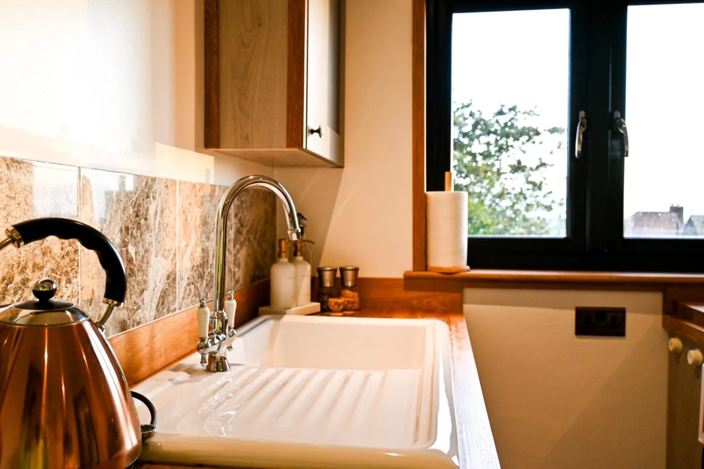 Prepare morning coffee or a relaxed supper while enjoying leafy views through the kitchen window and the quiet of your rural surroundings.