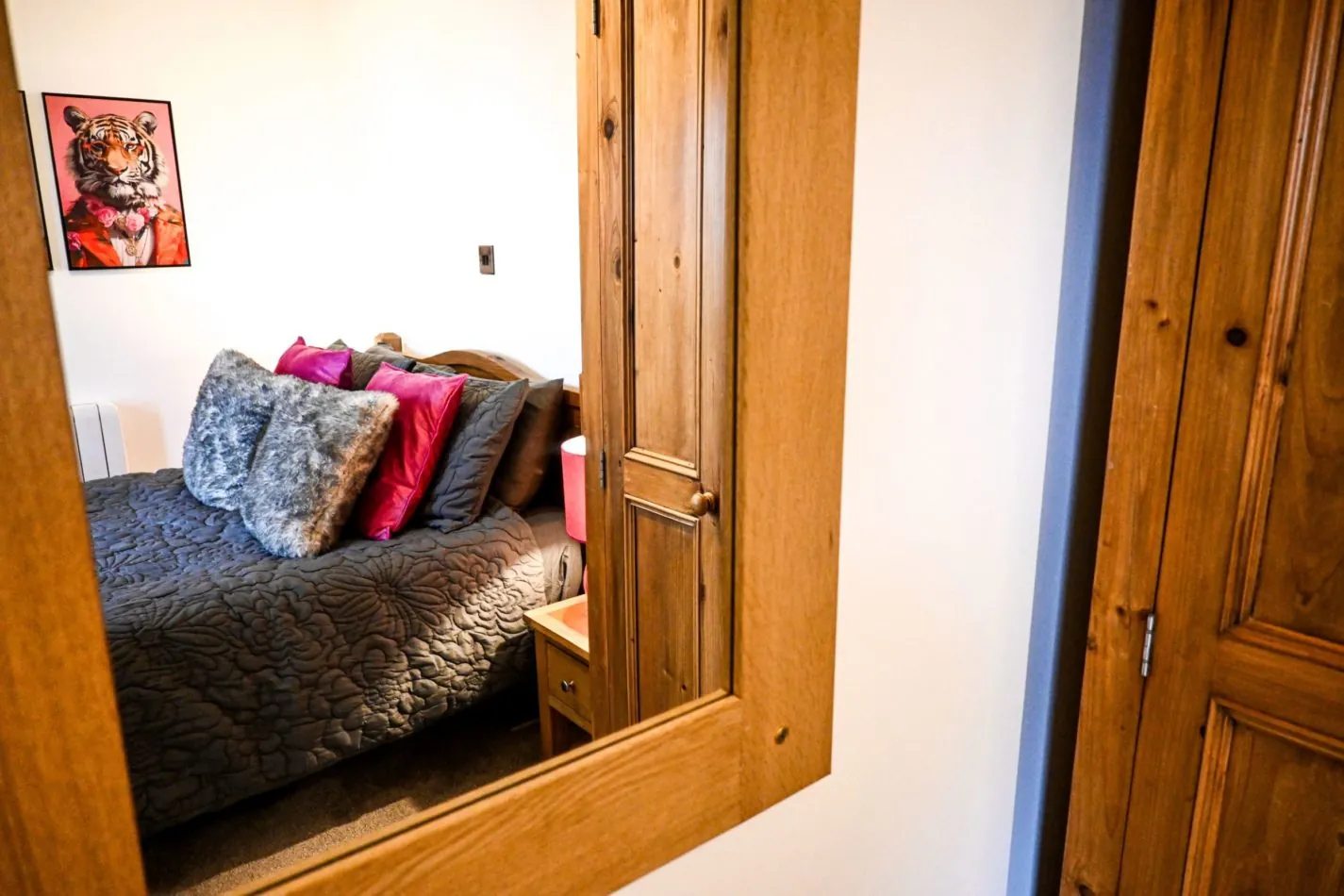 Warm wood, colourful cushions and thoughtful details give the double bedroom a cosy, characterful feel you’ll love returning to each evening.