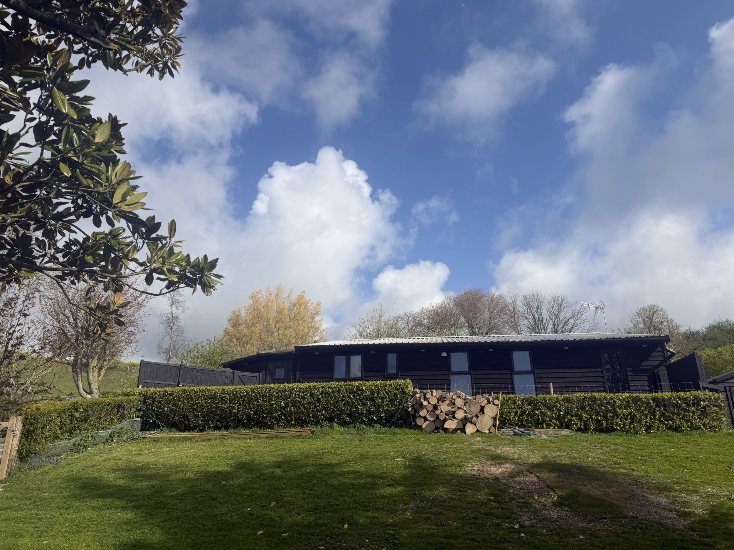 Arrive at your cosy timber cabin, tucked into the peaceful grounds of Honeypot Farm with convenient parking close by and beautiful countryside all around.