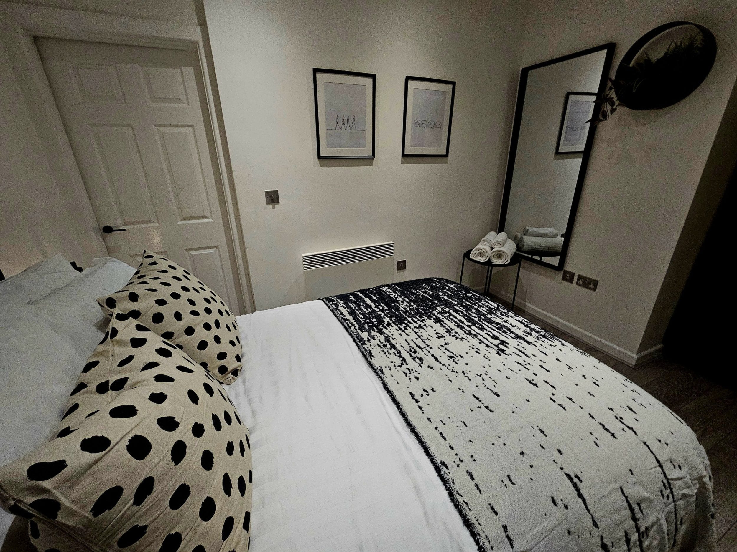 Comfortable double bedroom with storage for clothing and belongings, allowing longer-stay guests to properly unpack and settle in rather than living out of a suitcase throughout their time working in Liverpool.