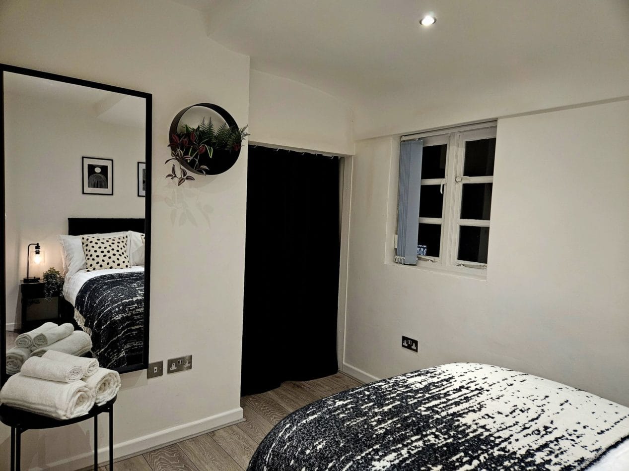 The separate double bedroom provides privacy away from the main living area – particularly valuable during longer stays. Comfortable accommodation where you can properly settle in while working away from home.