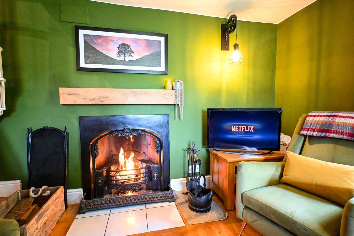The open log fire is perfect for cosy winter evenings curled up with a good book and your dog sitting at your feet