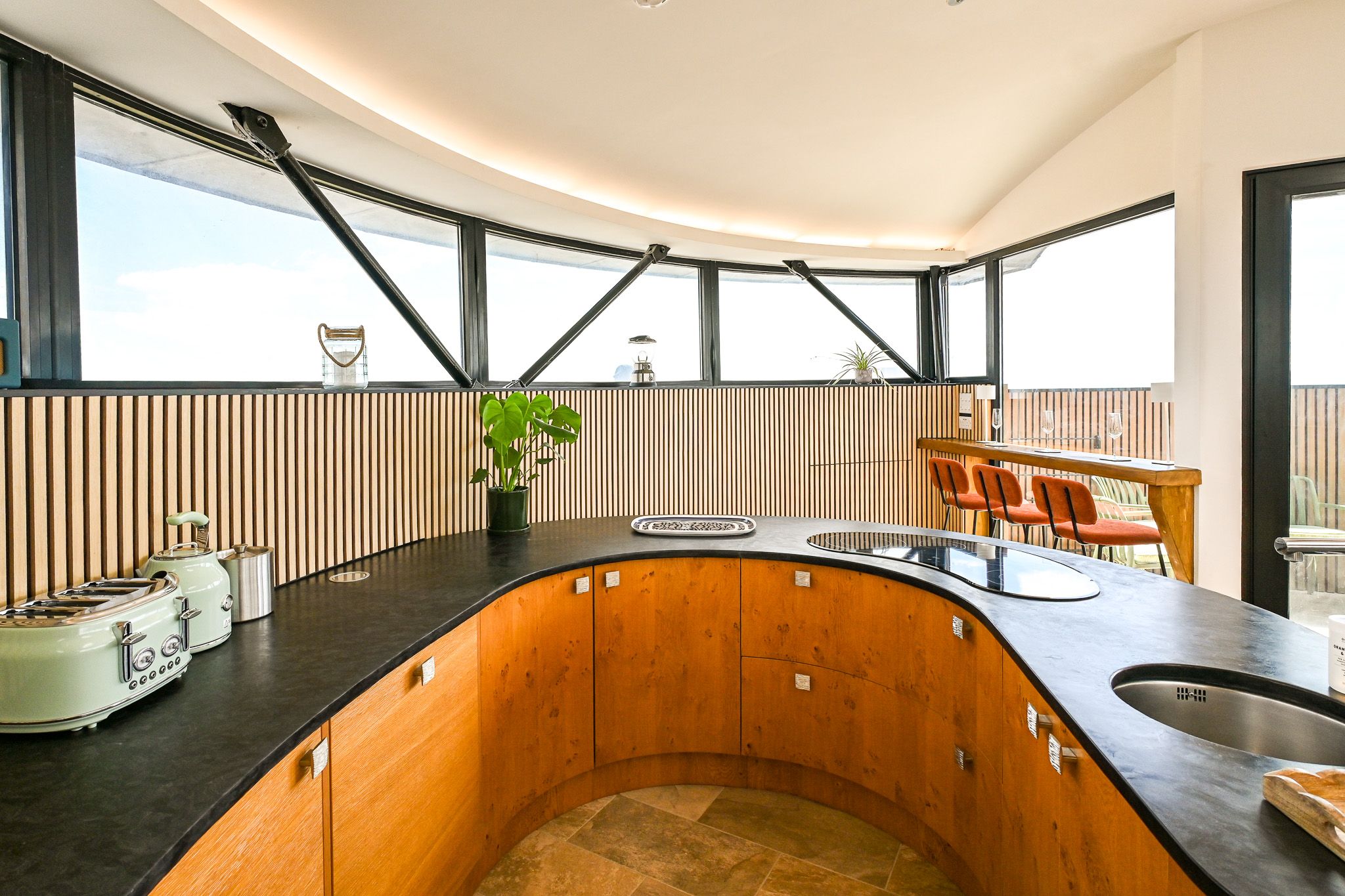 A kitchen unlike any other! Designed around the original curves of the Martello Tower, this beautifully fitted space combines centuries of history with everything you need for a fabulous group getaway.