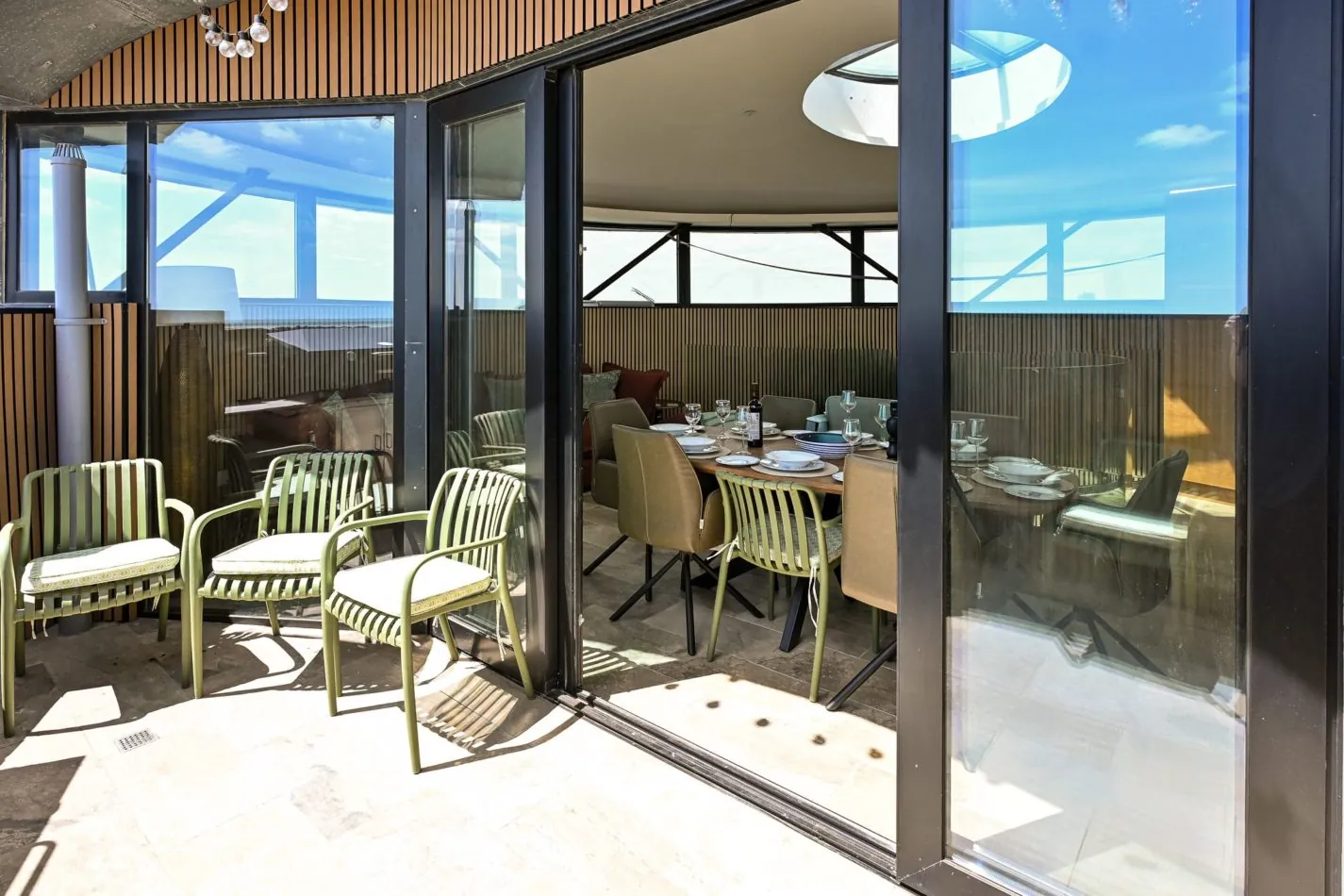 Indoor-outdoor living with a difference. Slide open the doors from the top-floor living space and step straight onto the private balcony — perfect for letting the sunshine and sea air roll into your holiday.