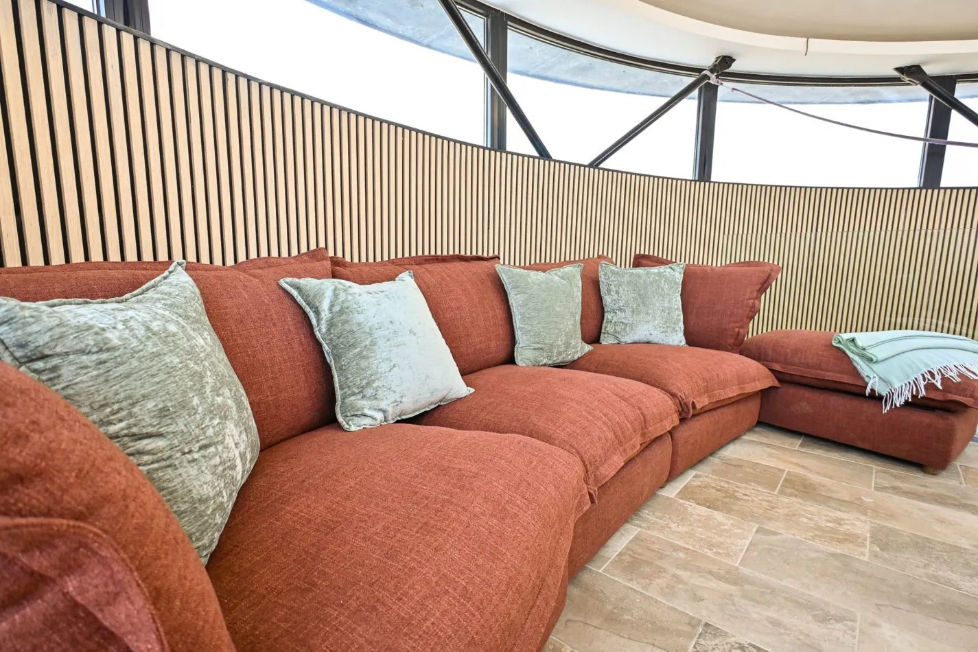 Sink into the huge curved sofa, designed to follow the shape of the tower itself. The perfect spot for the whole group to relax together after a day on the beach  or simply sit back and watch the world go by.