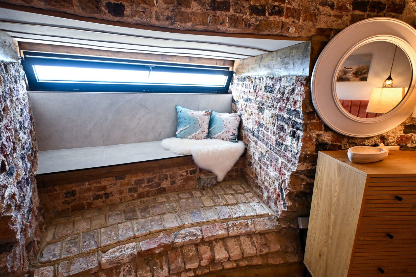 Claim this spot before anyone else does! Tucked into the enormous original walls, this gorgeous window seat is made for slow mornings, quiet reading and those rare holiday moments when there’s nowhere else you need to be.