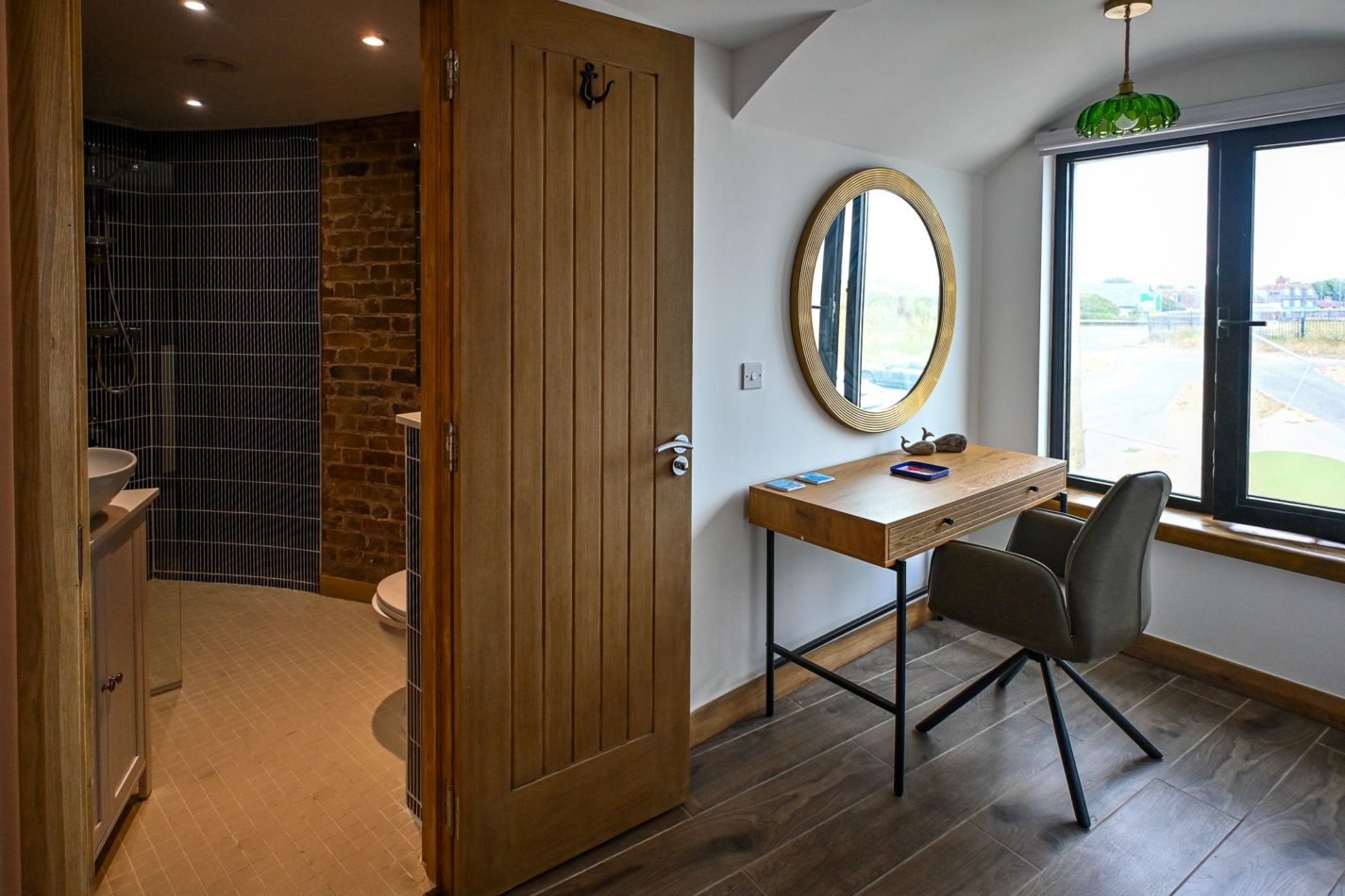 Your own little getting-ready space, complete with dressing table and natural light. Perfect when everyone is preparing for dinner — and another reason this tower works so brilliantly for group stays.