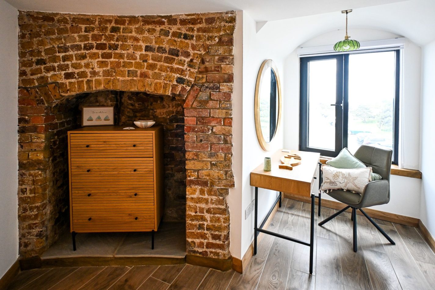 Take your time getting ready — you’re on holiday. A dedicated dressing area gives you useful extra space while exposed brick and curved walls make even the practical corners of Martello 25 feel special.