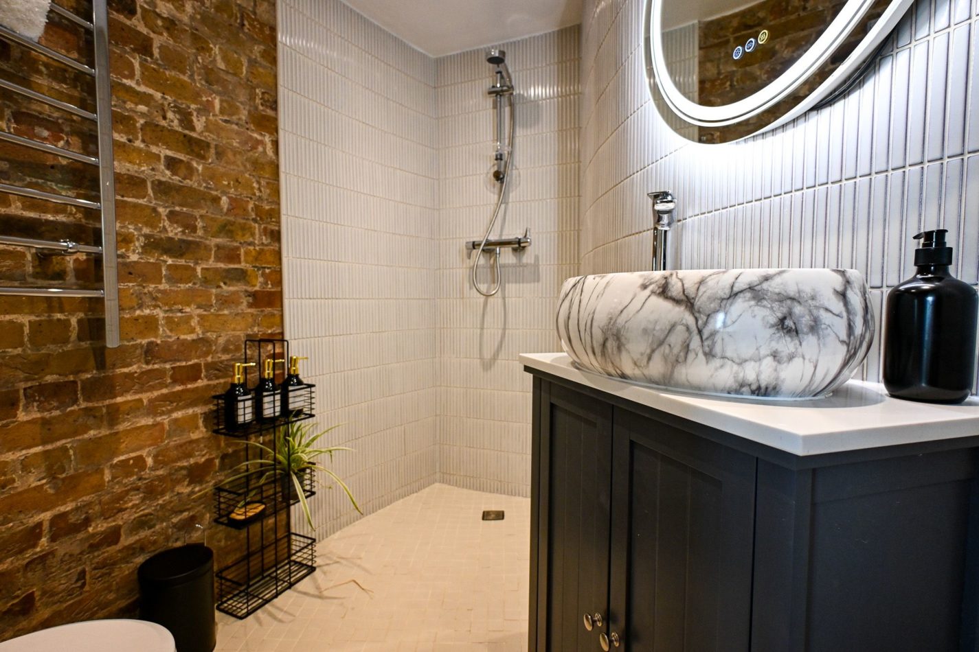 Beautifully designed en-suites mean every bedroom gets its own private space. Contemporary fittings contrast with original exposed brick — another gorgeous meeting of Martello 25’s past and present.