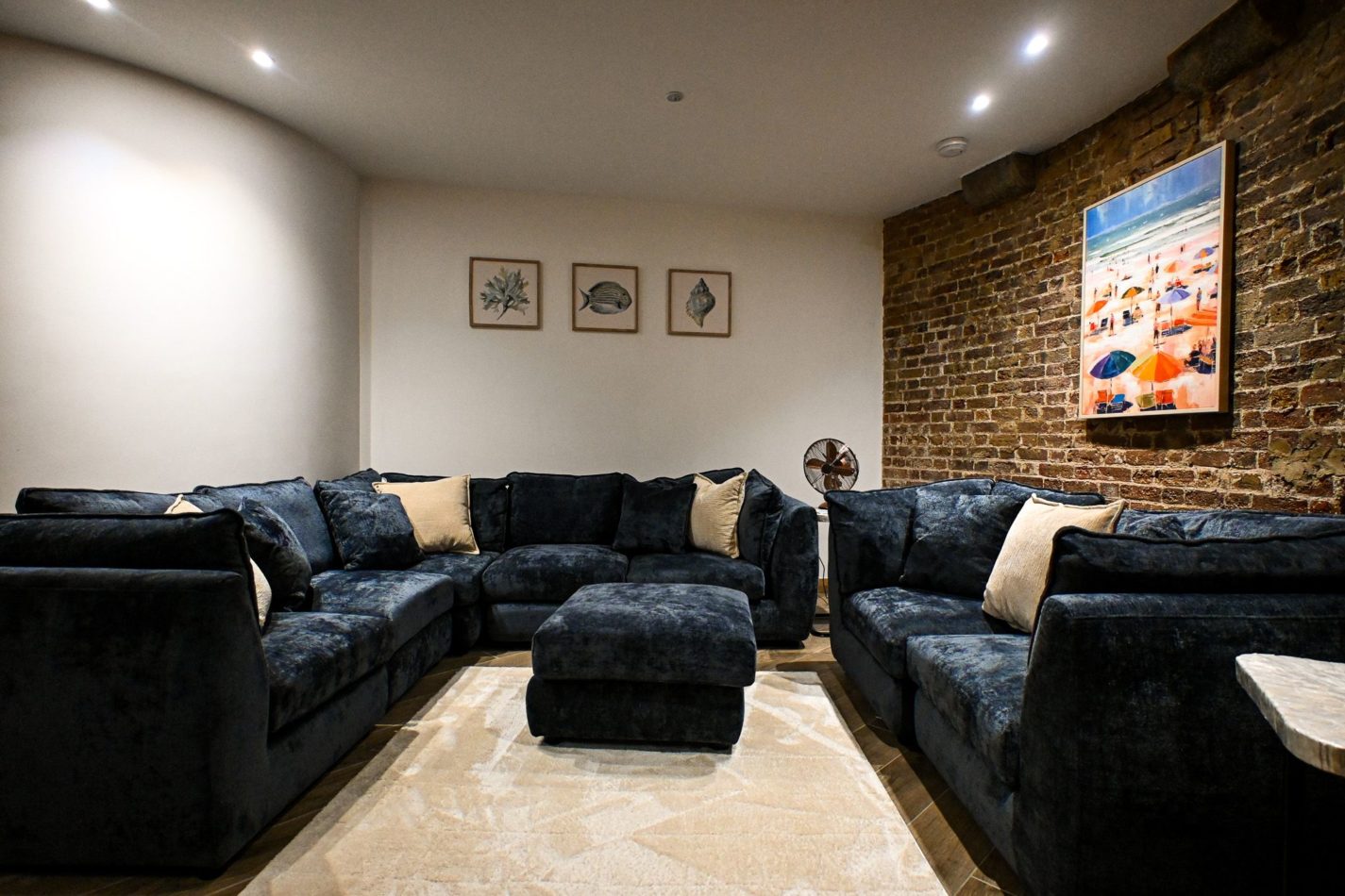 Deep sofas, soft lighting and space for everyone to flop. After beach walks, sightseeing and sea air, this cosy snug is exactly where you’ll want to disappear for an hour… or three.