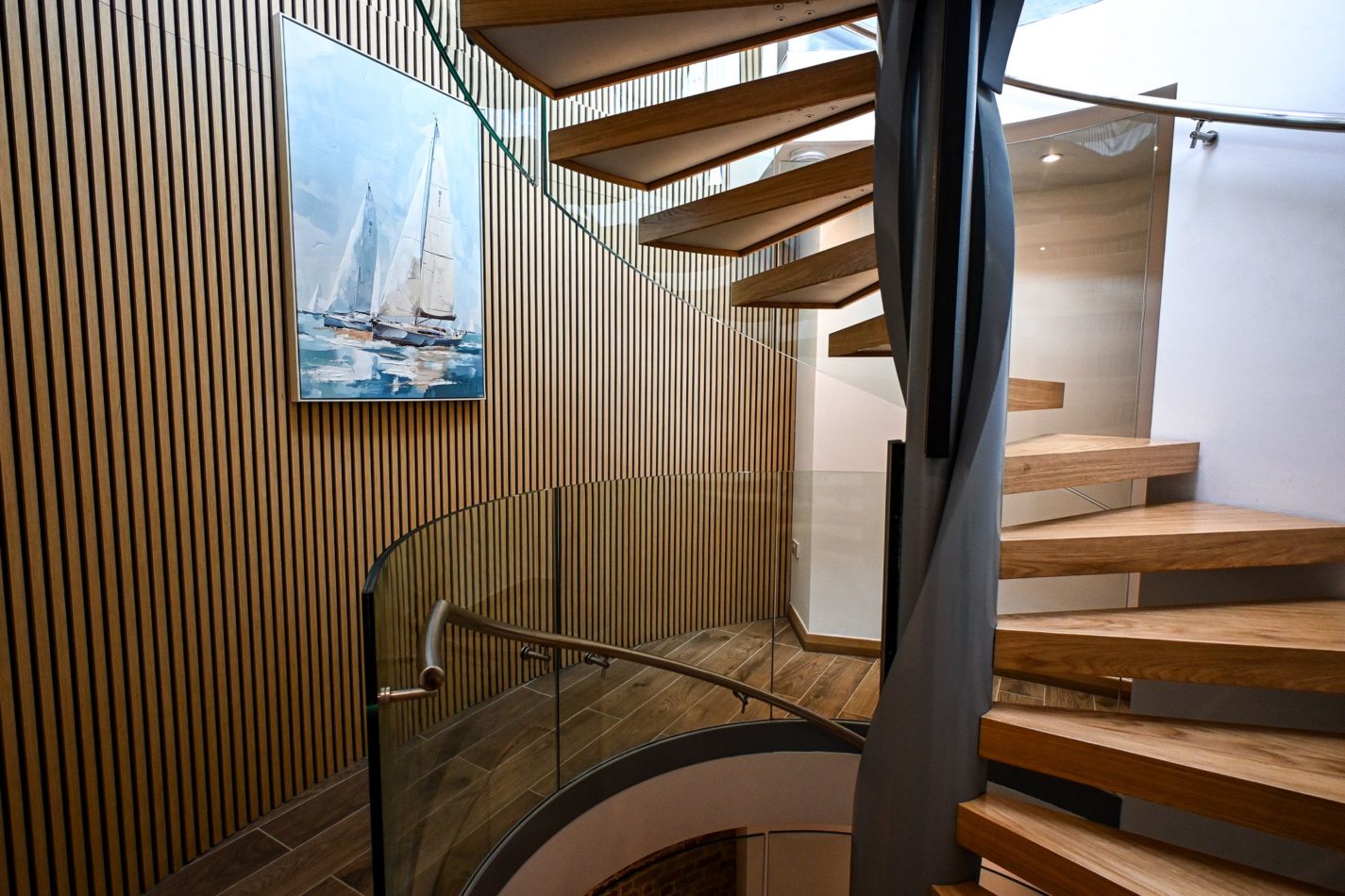 Follow the staircase upwards and watch the tower transform floor by floor, from cosy bedrooms and the cinema snug below to the spectacular open-plan living space waiting at the top.