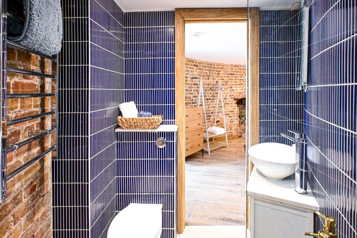 Cleverly designed spaces make the most of every curve of this historic building, with private en-suite facilities sitting just off the bedroom and original brickwork tying the spaces beautifully together.