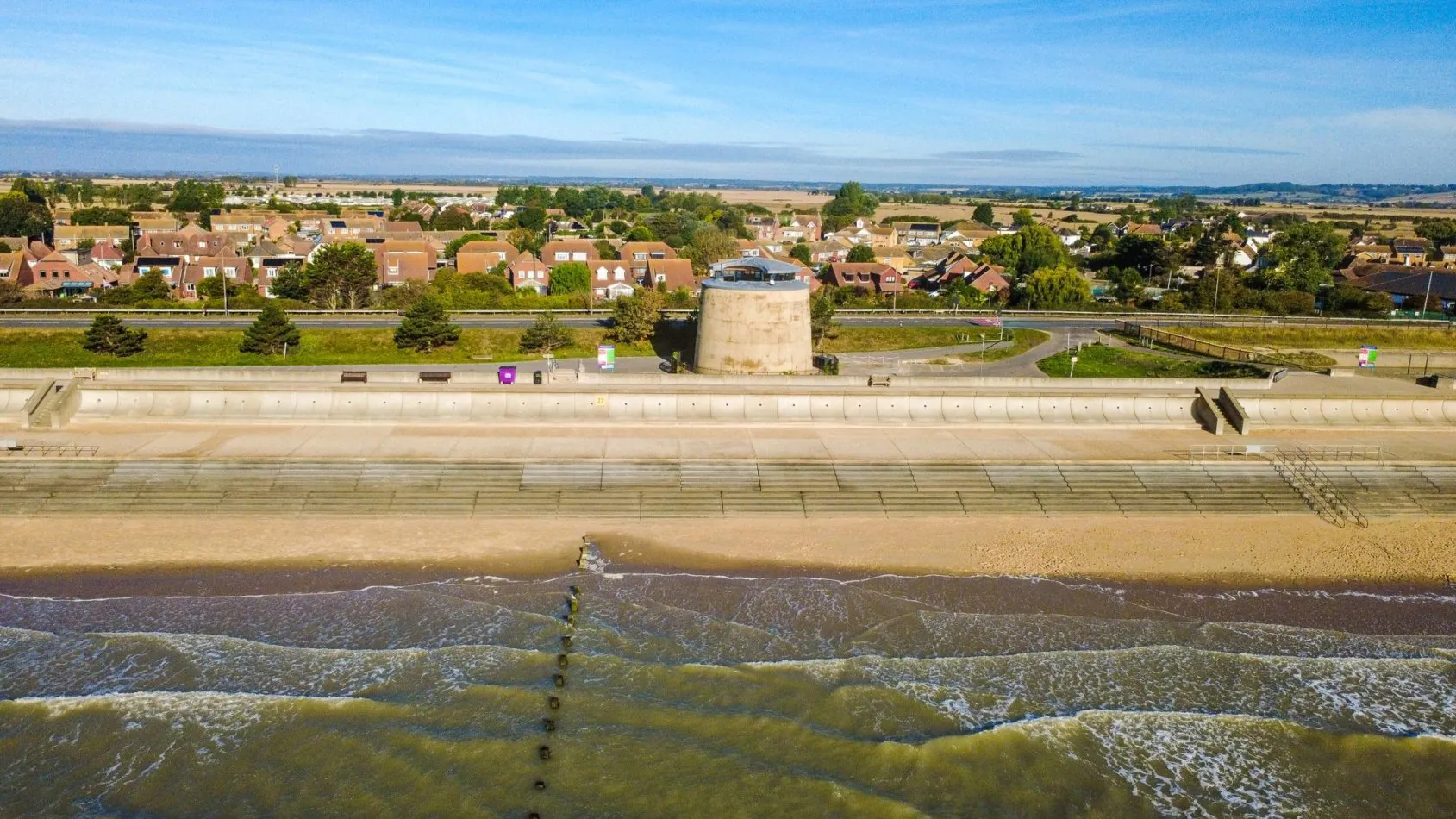 This is what we mean by beachfront! Martello 25 stands between Dymchurch and the sea, giving you an extraordinary historic home with miles of beach quite literally across the road.