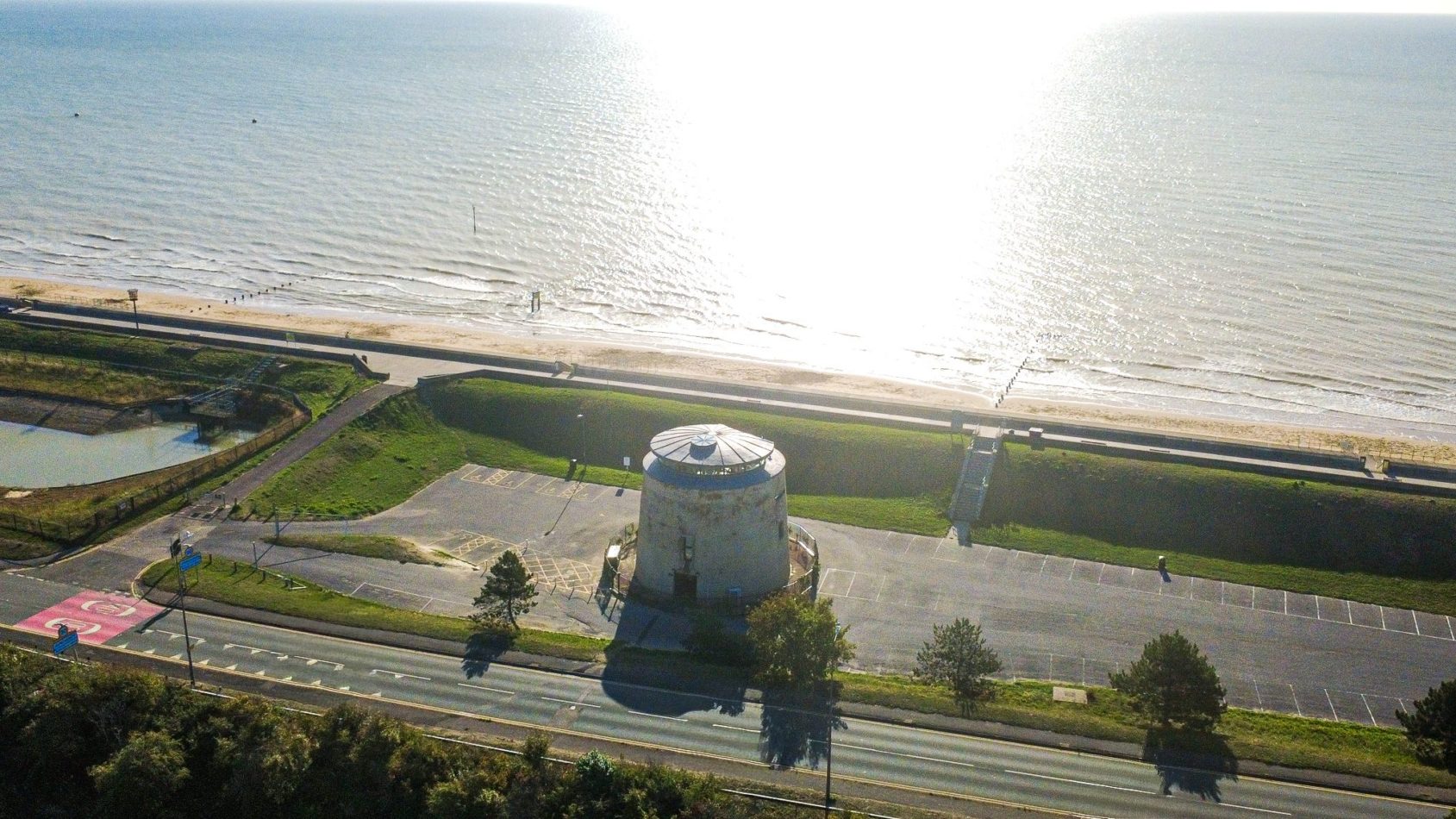One tiny tower, one enormous view. From above, you can see just how extraordinary Martello 25’s position is — the historic landmark sitting proudly beside the vast sweep of Dymchurch beach.