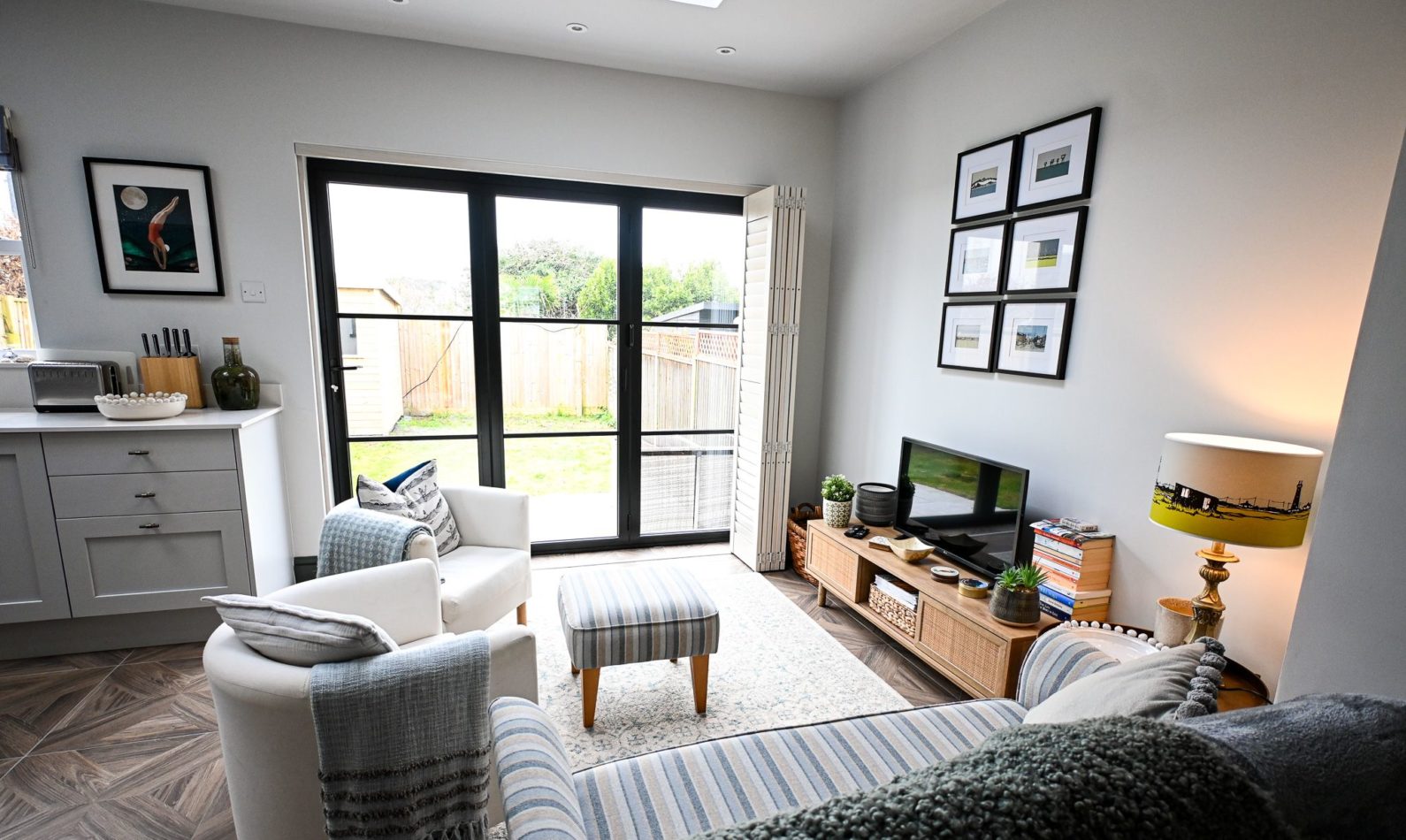 Enjoy a quiet moment in this bright and comfortable sitting area, with views towards the garden and plenty of natural light throughout the day.