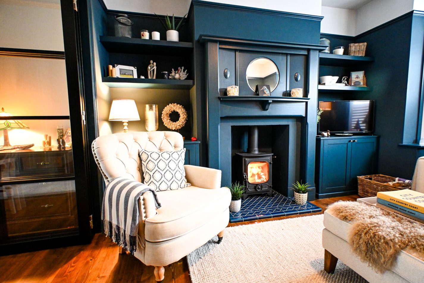 Settle into the cosy lounge, where rich blue walls, comfortable armchairs and a welcoming log burner create the perfect setting for relaxed evenings after exploring the Kent coast.