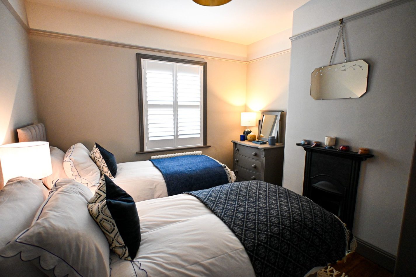 Soft bedding, calming colours and comfortable single beds make this flexible bedroom a welcoming retreat after a busy day of seaside adventures.
