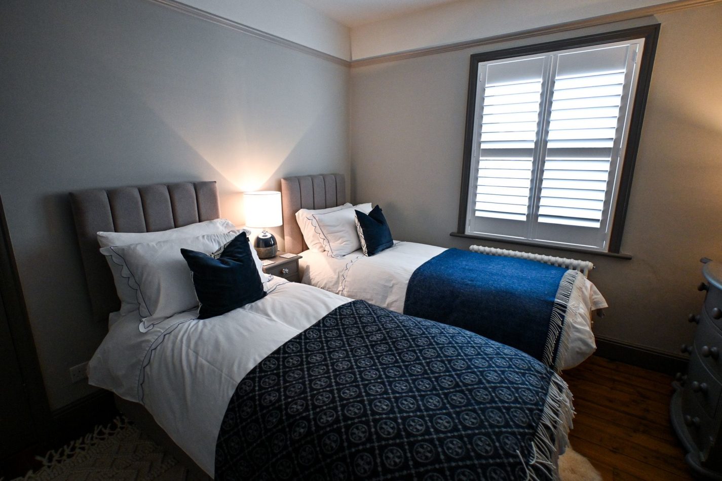 The peaceful twin bedroom offers comfortable beds and soft bedding, ideal for children, friends or family members enjoying a seaside break together.