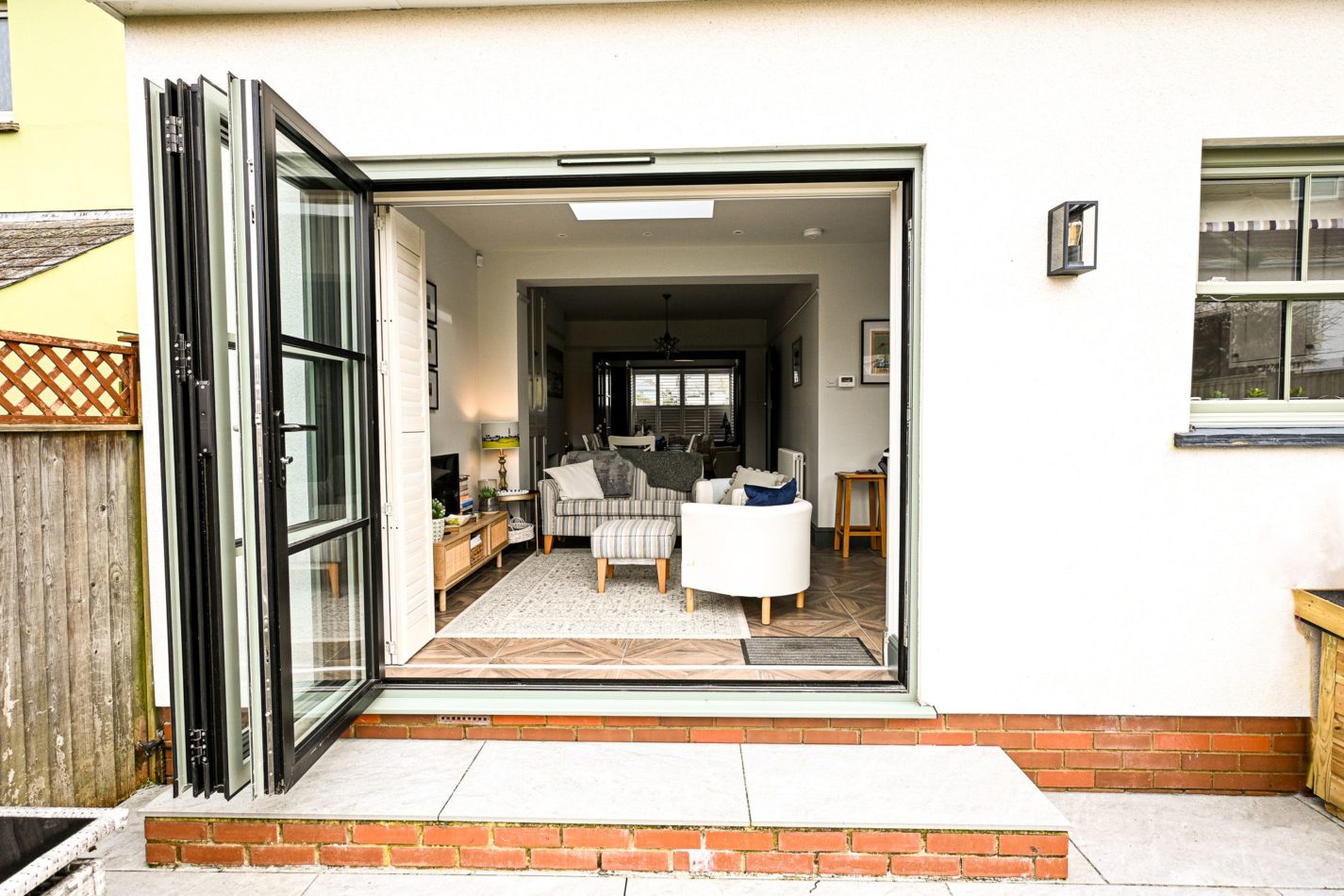 Open the doors onto the patio and garden, perfect for enjoying a little sunshine, fresh sea air and easy indoor outdoor living during your stay.