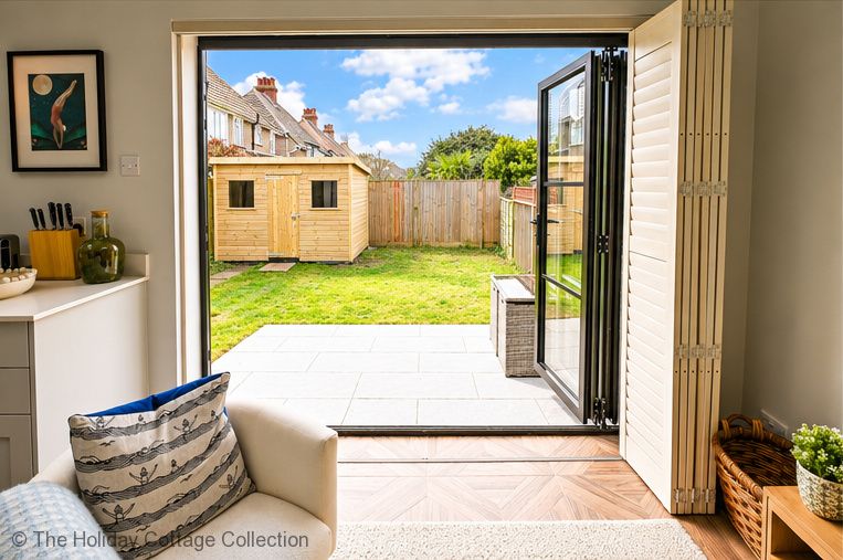 Open the bi fold doors and let the fresh coastal air drift inside, creating a lovely connection between the bright living space and enclosed rear garden.