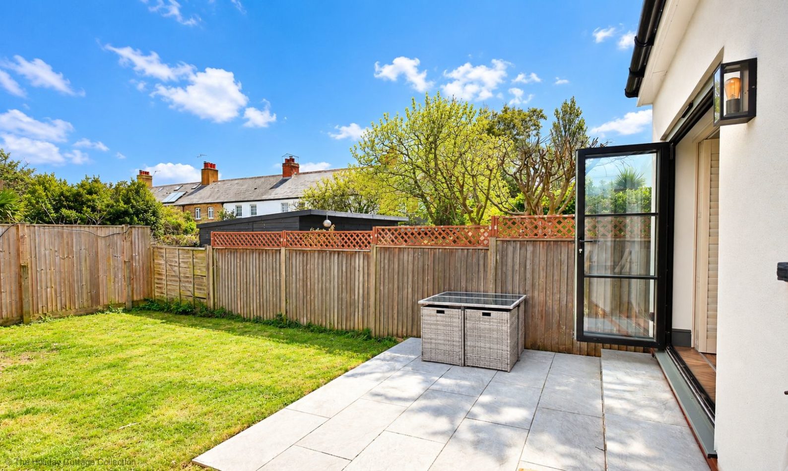 Step outside onto the patio and enjoy the enclosed rear garden, a lovely place for morning coffee, fresh air and time spent together.
